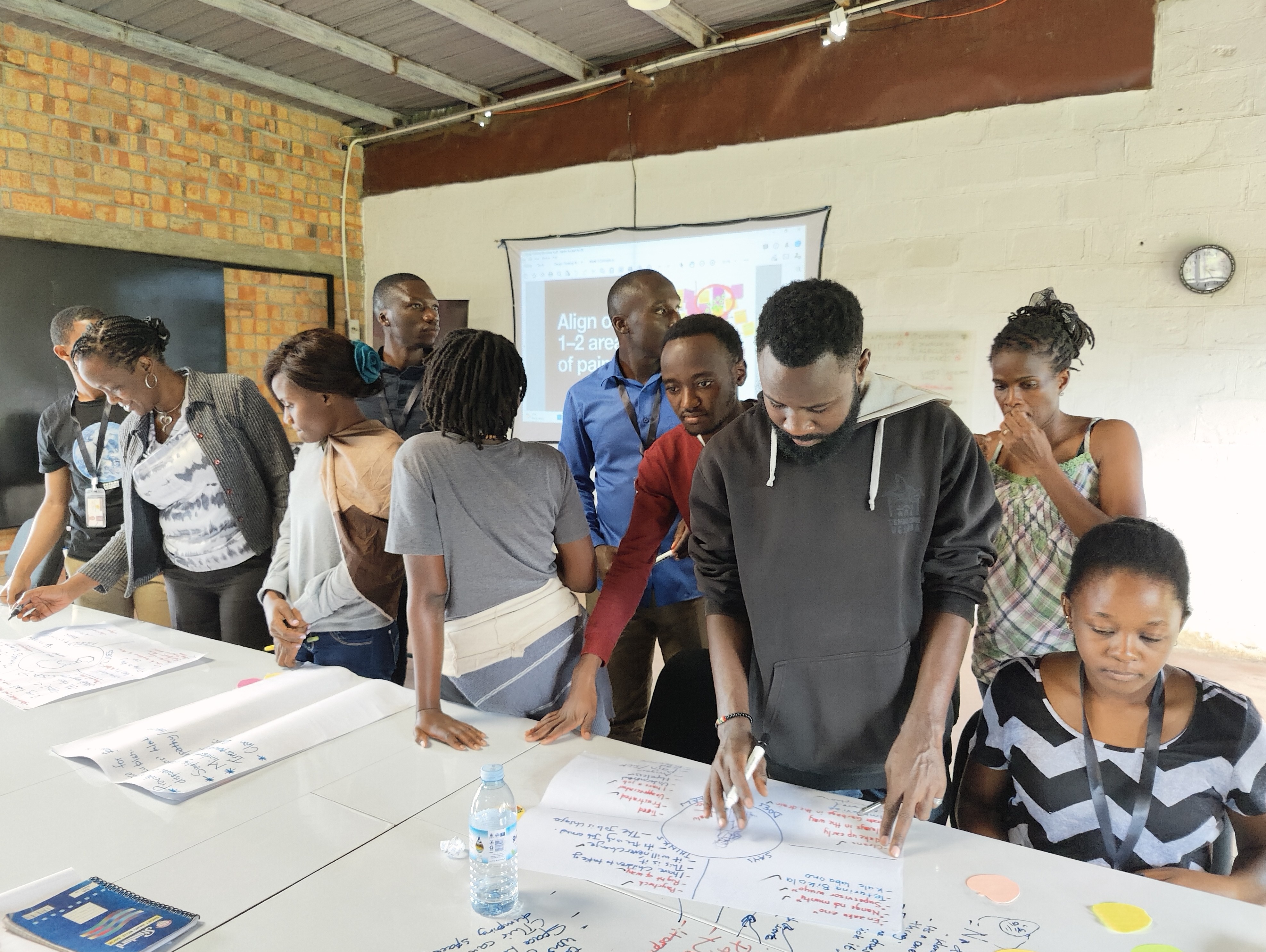 Students give a go at sketching on the white board tables