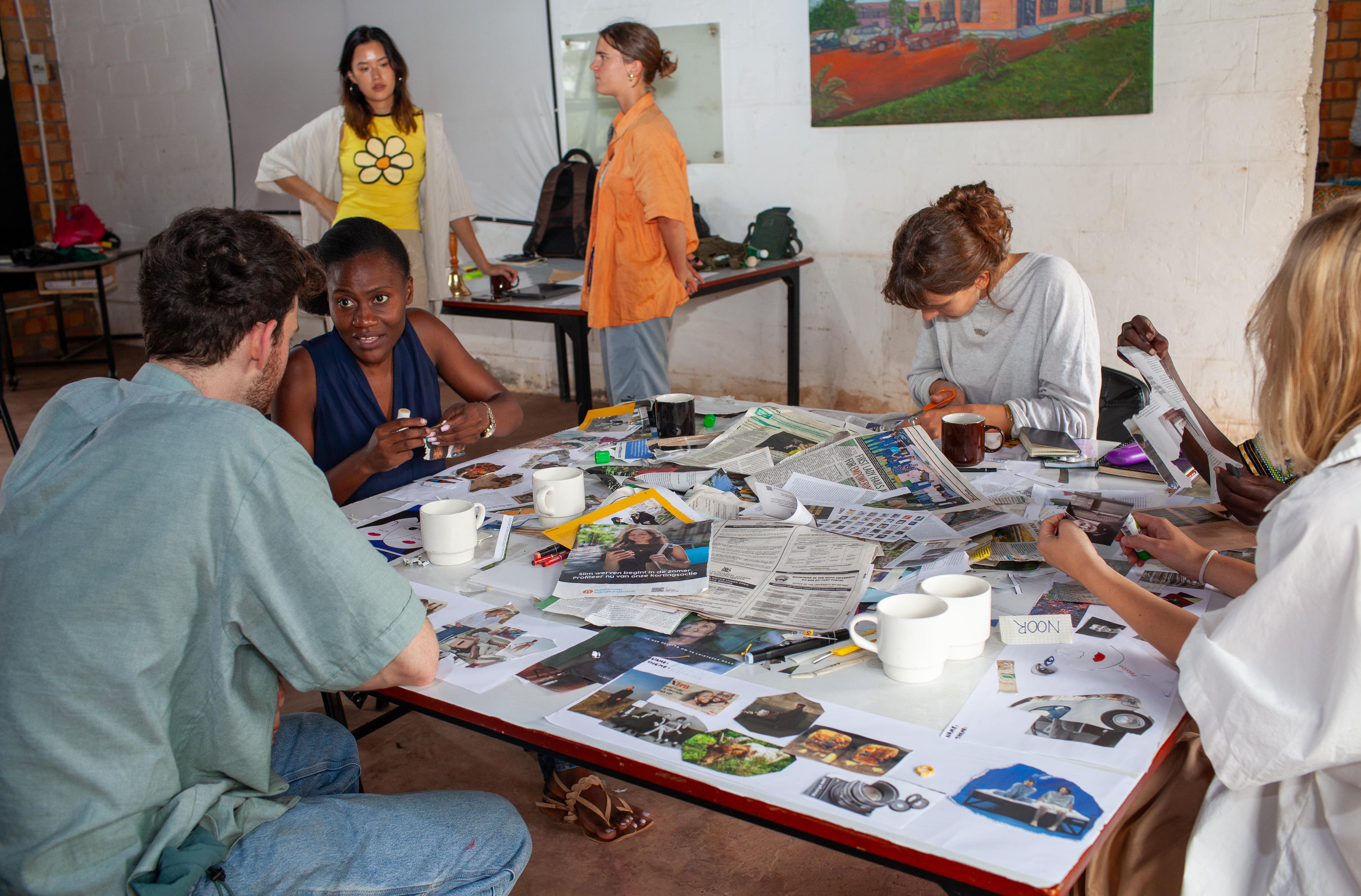 Participants are deeply focused on creating mood boards, a key step in the design process.